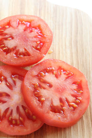 freshness sliced tomato on wooden cutting boardの写真素材