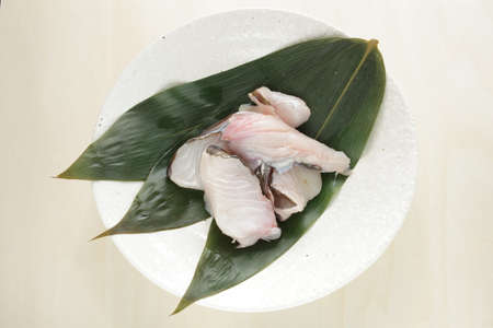 Freshness raw cod fish on leaf for cooking ingredientの写真素材