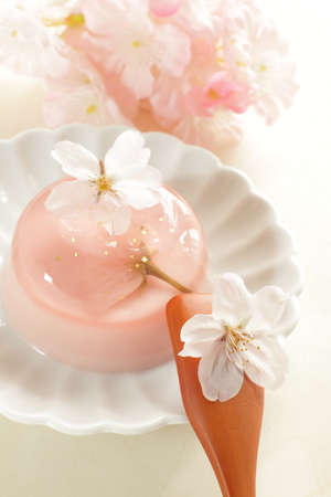 Edible cherry blossom jelly with gold dust for gourmet spring dessertの写真素材