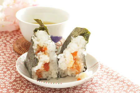 Japanese food, Ikura fish roe in rice ball in halved which showing the fillingの写真素材