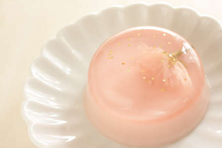 Edible cherry blossom jelly with gold dust for gourmet spring dessertの写真素材