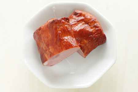 Chinese food, roasted pork halved on plate for gourmet comfort foodの写真素材