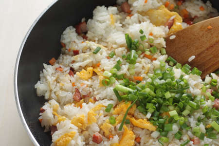 Cooking of roasted pork and egg fried rice by frying panの写真素材