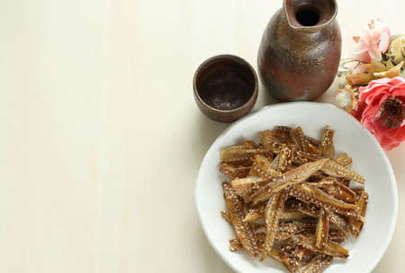 Japanese food, dried eel fish bone  and Sakiの写真素材