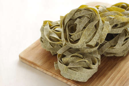 Italian food ingredient, dried pasta Spinach fettuccineの写真素材