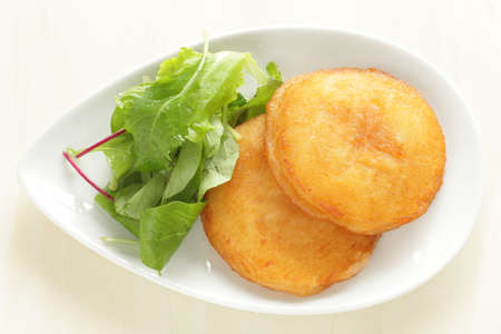 Asian street food, potato rice cake on dishの写真素材