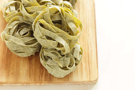 Italian food ingredient, dried pasta Spinach fettuccineの写真素材