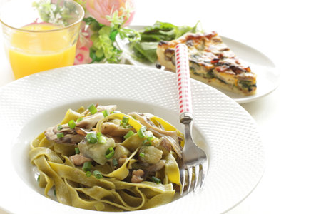 Italian food, Japanese Shimeji mushroom and eggplant in green  spinach fettuccineの写真素材