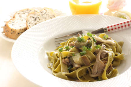Italian food, Japanese Shimeji mushroom and eggplant in green  spinach fettuccineの写真素材