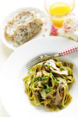 Italian food, Japanese Shimeji mushroom and eggplant in green  spinach fettuccineの写真素材