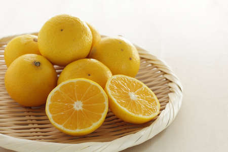 Shonan Golden, Japanese fruit on bamboo basketの写真素材