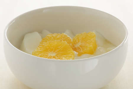 cut mandarin orange and yogurt for healthy breakfastの写真素材