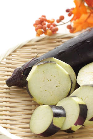 chopped Japanese eggplant on bamboo basket with copy space for cooking ingredientの写真素材