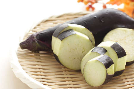 chopped Japanese eggplant on bamboo basket with copy space for cooking ingredientの写真素材