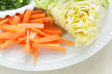 prepared chopped vegetables for Chinese cookingの写真素材