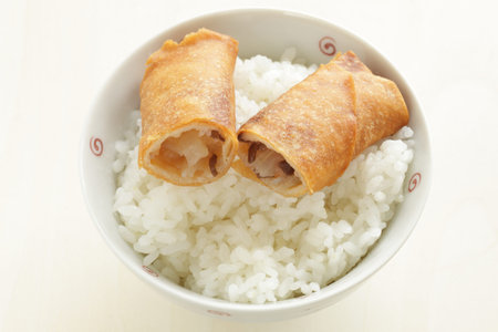 Chinese food, spring roll in half for dumpling on rice
