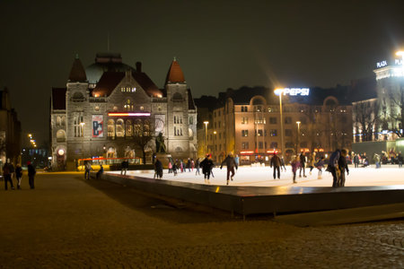 Helsinki, Finland - December 26, 2013 - Ice skating in Helsinki Central Railway Station Squareのeditorial素材