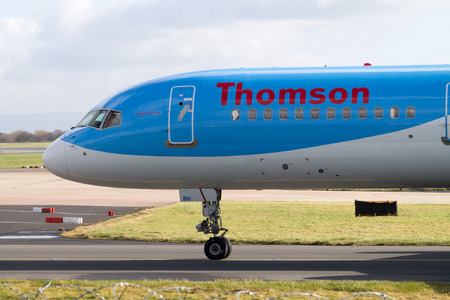 Manchester, United Kingdom - February 16, 2014  Thomson Airways Boeing 757-200 plane on Manchester Airport runway, front part of the planeのeditorial素材