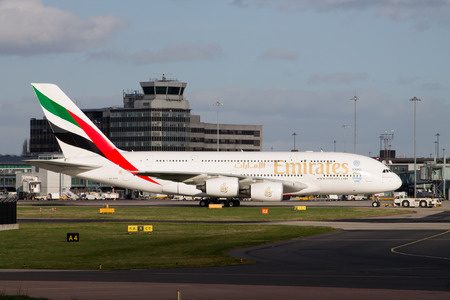 Manchester, United Kingdom - February 16, 2014  Emirates Airlines Airbus A380 taxiing on Manchester Airport runwayのeditorial素材