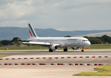 Air France Airbus A321 narrow-body passenger plane F-GTAS taxiing, Manchester International Airport, United Kingdom.のeditorial素材