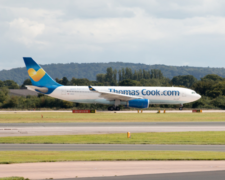Thomson Airways Boeing 757 narrow-body passenger plane G-OOBD departing from Manchester International Airport runway.のeditorial素材