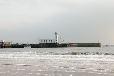Scarborough Lighthouse and the seafront. Scarborough, United Kingdom.