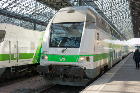 InterCity double-decker high speed trains in a platform in Helsinki Railway Station.のeditorial素材
