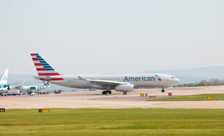 American Airlines Airbus A330 wide-body passenger plane (N288AY) taxiing on Manchester International Airport tarmac.のeditorial素材