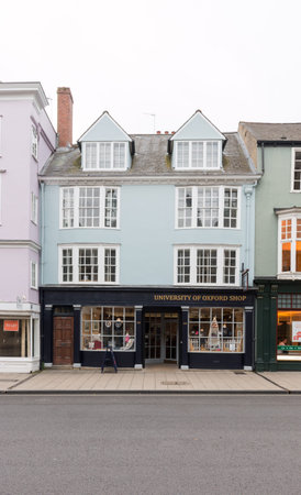 University of Oxford Shop in busy shopping street of Oxford, United Kingdom. Overcast weather.のeditorial素材