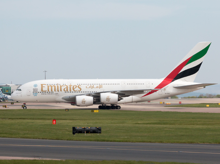 Emirates A380-861 double-decker wide-body passenger plane (A6-EDX) taxiing on Manchester International Airport tarmac.のeditorial素材