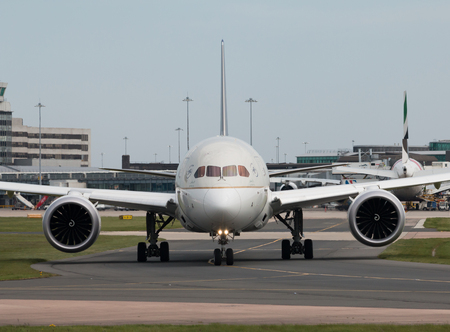 Saudia Boeing 787-9 wide-body passenger plane (HZ-ARA) taxiing on Manchester International Airport tarmac.のeditorial素材