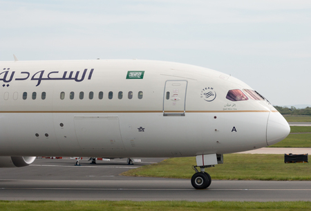 Saudia Boeing 787-9 wide-body passenger plane (HZ-ARA) taxiing on Manchester International Airport tarmac.のeditorial素材