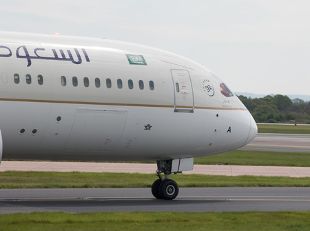 Saudia Boeing 787-9 wide-body passenger plane (HZ-ARA) taxiing on Manchester International Airport tarmac.のeditorial素材