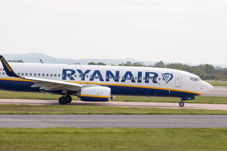 Ryanair Boeing 737-8AS narrow-body passenger plane taxiing on Manchester International Airport tarmac.のeditorial素材