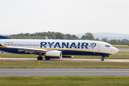 Ryanair Boeing 737-8AS narrow-body passenger plane taxiing on Manchester International Airport tarmac.のeditorial素材
