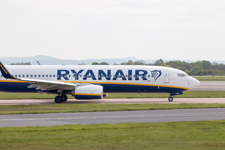 Ryanair Boeing 737-8AS narrow-body passenger plane taxiing on Manchester International Airport tarmac.のeditorial素材