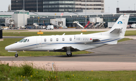 Premium Jet Cessna Citation Excel (Model 560XL) medium-sized business jet  (HB-VOU) taxiing on Manchester International Airport.のeditorial素材