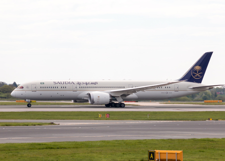 Saudia Boeing 787-9 wide-body passenger plane (HZ-ARA) taking off from Manchester International Airport runway.のeditorial素材