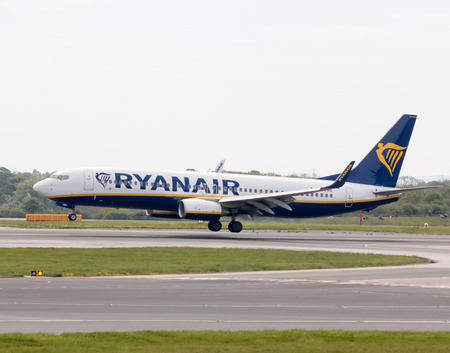 Ryanair Boeing 737-8AS narrow-body passenger plane (EI-DWE) landing to Manchester International Airport runway.のeditorial素材