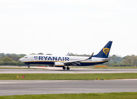 Ryanair Boeing 737-8AS narrow-body passenger plane (EI-DWE) landing to Manchester International Airport runway.のeditorial素材
