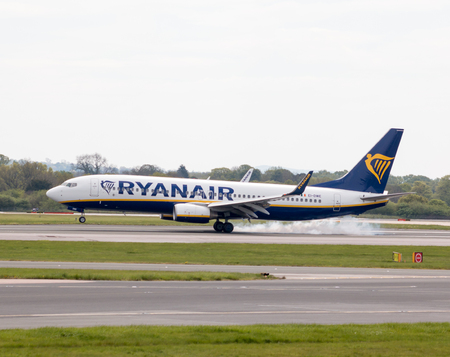 Ryanair Boeing 737-8AS narrow-body passenger plane (EI-DWE) landing to Manchester International Airport runway.のeditorial素材