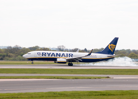 Ryanair Boeing 737-8AS narrow-body passenger plane (EI-DWE) landing to Manchester International Airport runway.のeditorial素材