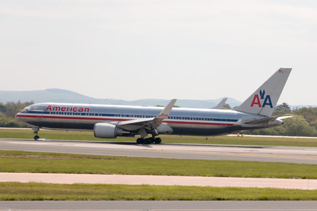 American Airlines Airbus A330 wide-body passenger plane (N362AA) landing to Manchester International Airport runway.のeditorial素材