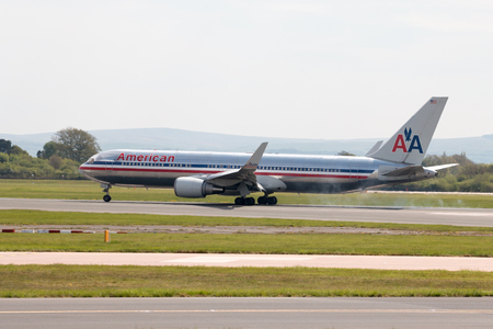 American Airlines Airbus A330 wide-body passenger plane (N362AA) landing to Manchester International Airport runway.のeditorial素材
