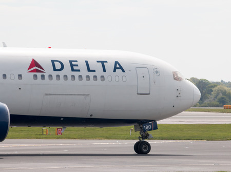Delta Air Lines Boeing 767-332(ER) wide-body passenger plane (N180DN) taxiing on Manchester International Airport tarmac.のeditorial素材