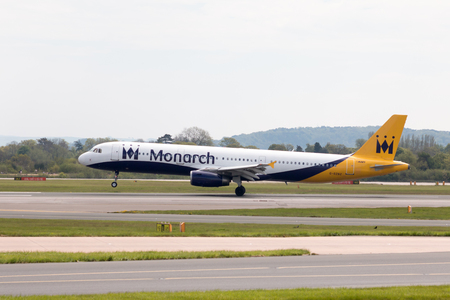 Monarch Airlines Airbus A320-231 narrow-body passenger plane landing to Manchester International Airport runway.のeditorial素材