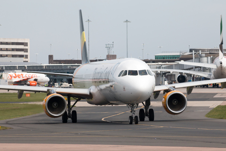 Thomas Cook Airlines Airbus A321-211 wide-body passenger plance (G-TCDZ) taxiing on Manchester International Airport tarmac.のeditorial素材