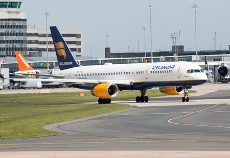 Icelandair Boeing 757-200 narrow-body passenger plane (TF-ISL) taxiing on Manchester International Airport tarmac.のeditorial素材