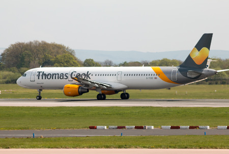 Thomas Cook Airlines Airbus A321-211 wide-body passenger plance (G-TCDZ) taking off from Manchester International Airport runway.のeditorial素材