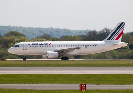 Air France Airbus A320 narrow-body passenger plane (F-GKXZ) taxiing on Manchester International Airport tarmac.のeditorial素材